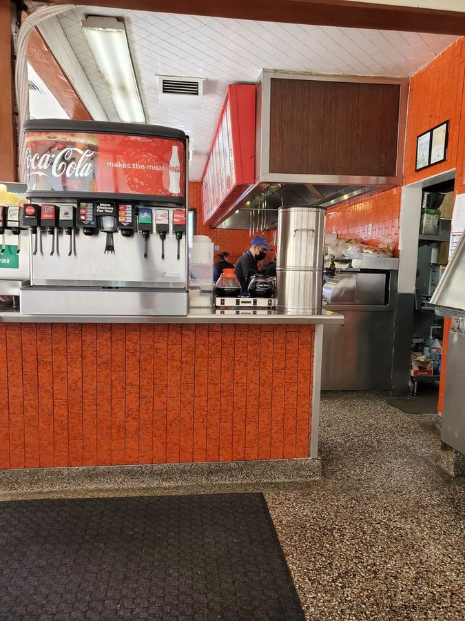 The order counter at Pete's with its orange tile and soda fountain