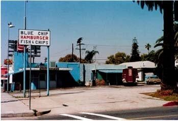 Old photograph of the original Blue Chip Hamburger and Fish and Chips stand with its roadside sign